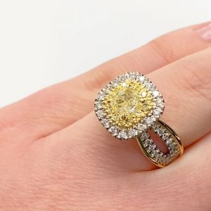 Cushion cut yellow diamond cluster ring