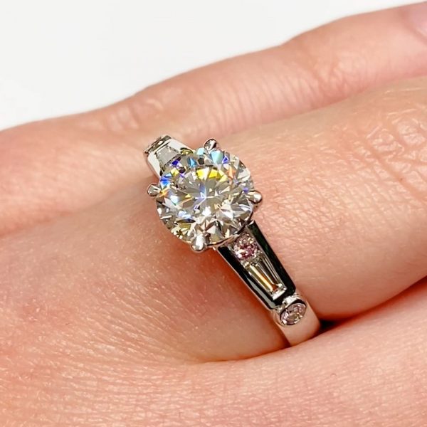 Solitaire, pink diamonds & baguettes ring